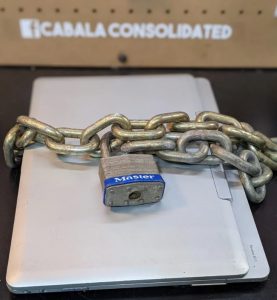 Laptop with padlock on the table