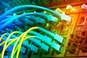 Fiber Optic cables connected to optic ports and UTP, Network cables connected to ethernet ports