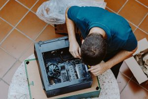 Technician repair assembles computer at home