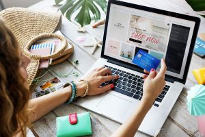 Woman online shopping with her laptop