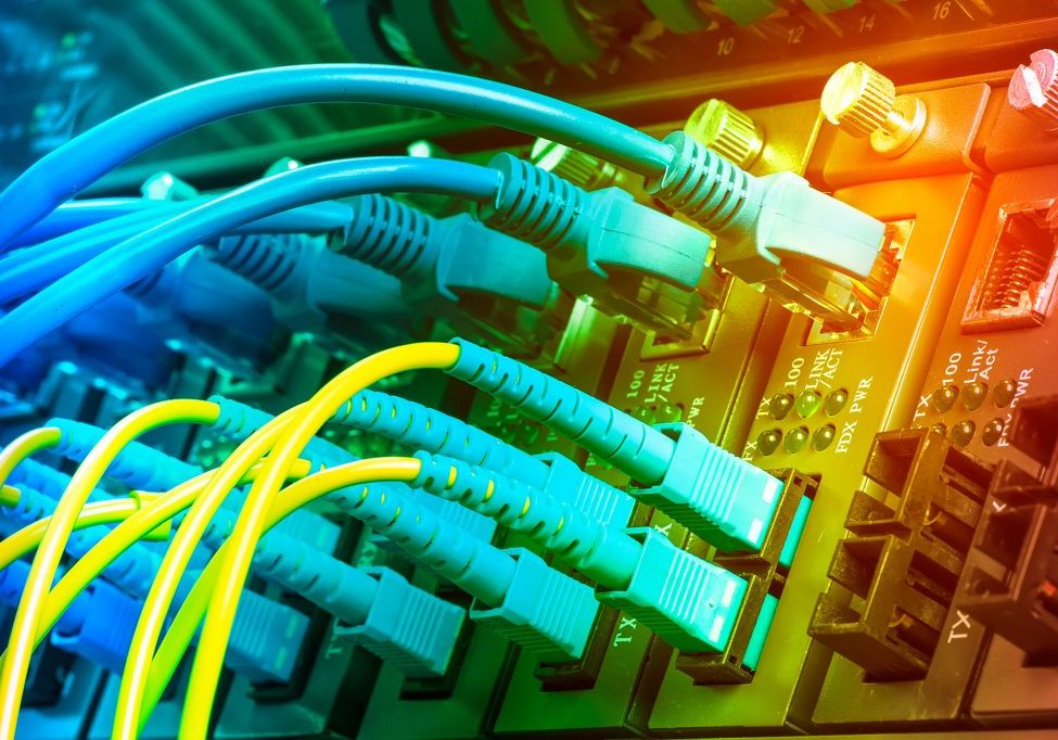 Fiber Optic cables connected to optic ports and UTP, Network cables connected to ethernet ports