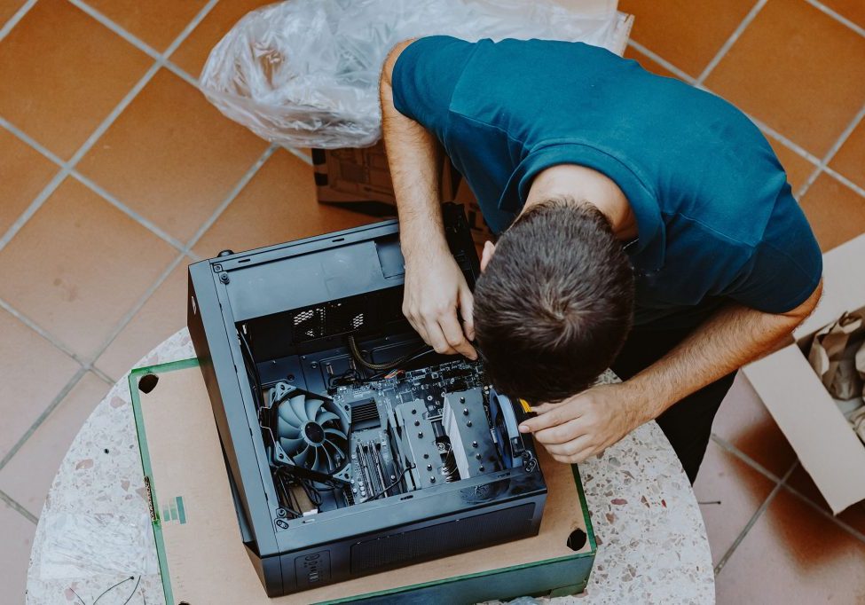 Technician repair assembles computer at home