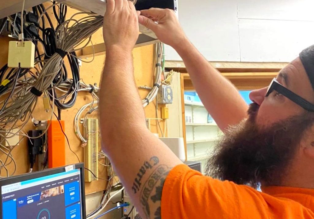 Computer technician checking network cables